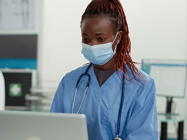 Nurse looking at computer